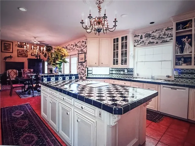 a kitchen with stainless steel appliances granite countertop a stove and a sink