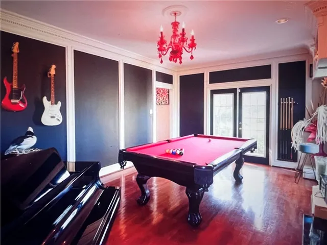 a dining room with furniture and chandelier