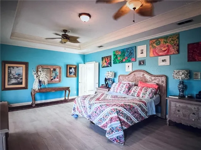 a bedroom with a bed and dresser