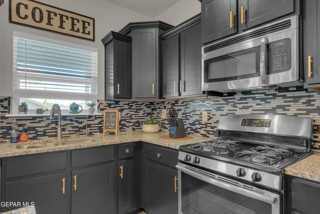 a living room with furniture a chandelier and a table