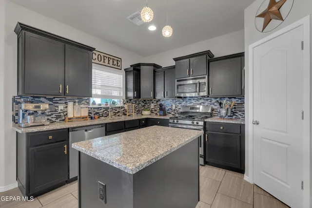 a very nice looking dining room with a table and chairs