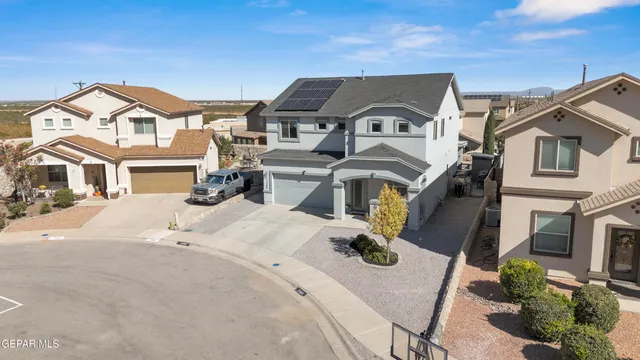a view of a white building with many windows