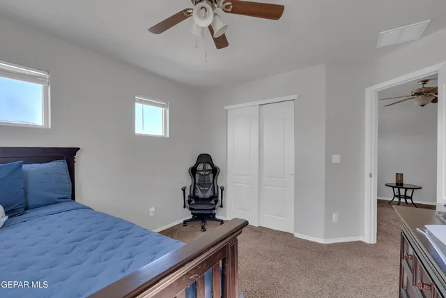 a living room with furniture and a lamp