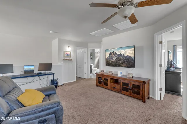 a view of a living room and workspace