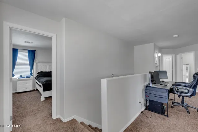 a living room with fireplace furniture and a large window