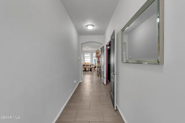 a view of a hallway with some storage and utility room