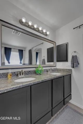 a bedroom with furniture and a ceiling fan