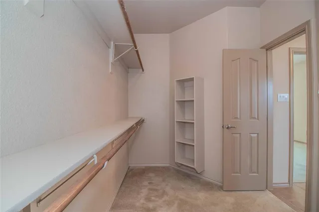 a view of an empty walk in closet