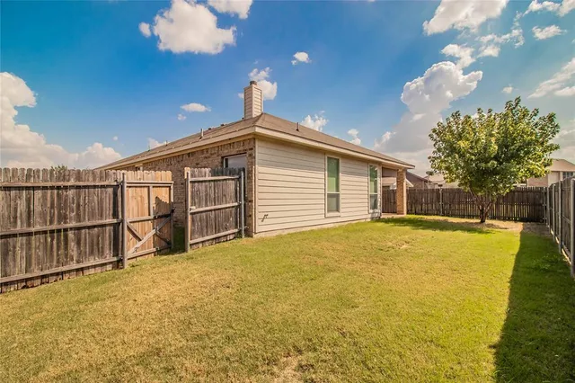 a view of a swimming pool with an outdoor space and seating area