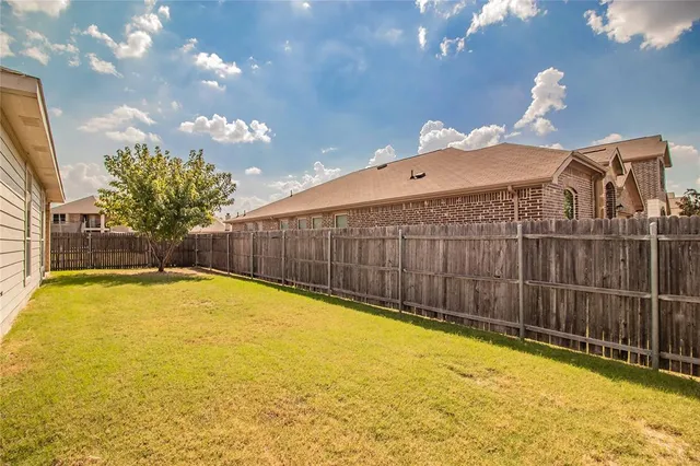 a view of a porch with a small yard