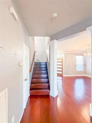 a view of an entryway with wooden floor