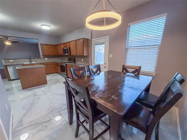 a view of a dining room with furniture