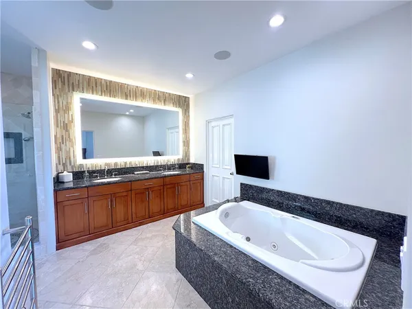 a bathroom with a bathtub and a window