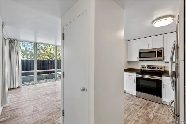 a view of a kitchen with microwave and stove
