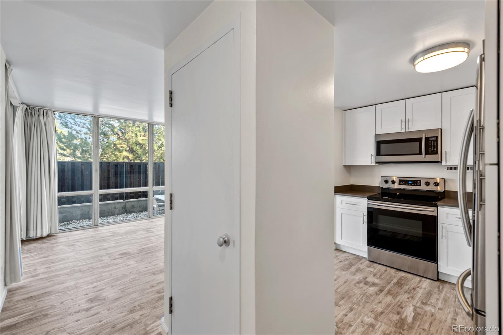 3100 East Cherry Crk N Drive, Unit 108 Denver, CO 80209 - Photo 21 of 25 a view of a kitchen with microwave and stove