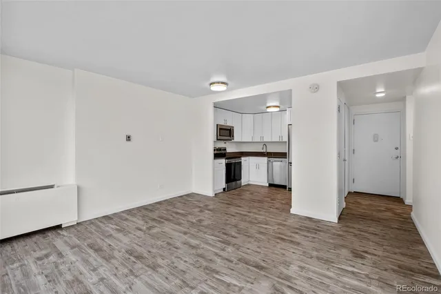 a view of kitchen with wooden floor