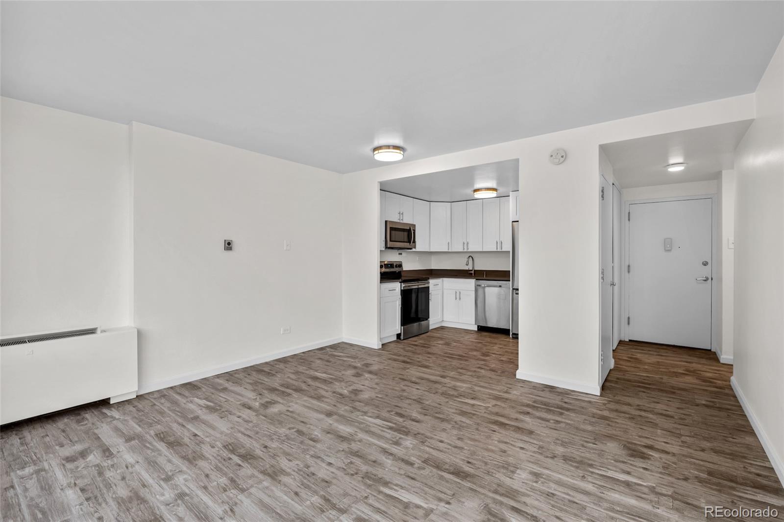 3100 East Cherry Crk N Drive, Unit 108 Denver, CO 80209 - Photo 4 of 25 a view of kitchen with wooden floor