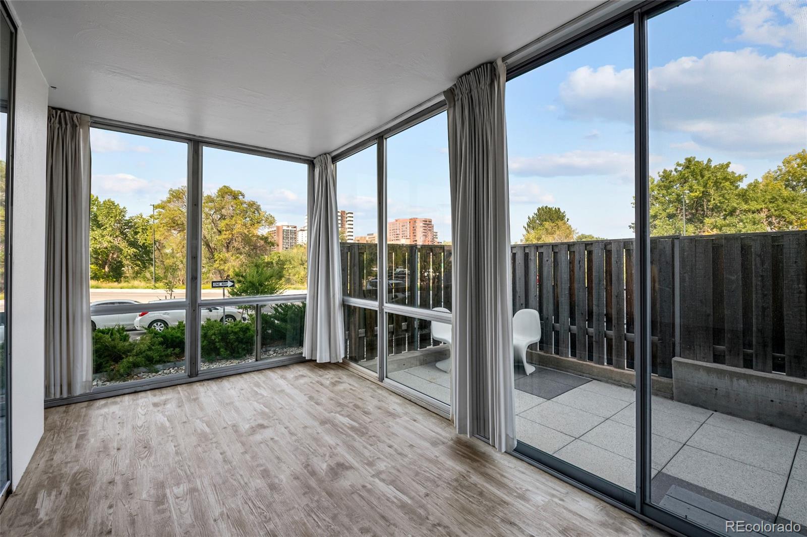 3100 East Cherry Crk N Drive, Unit 108 Denver, CO 80209 - Photo 6 of 25 a view of a room with wooden floor and outdoor view