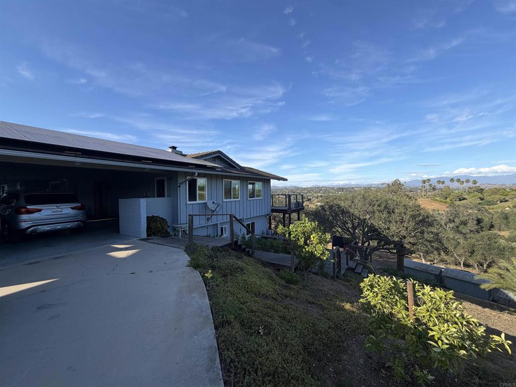 435 Rancho Camino Fallbrook, CA 92028 - Photo 3 of 6 a view of a house with a yard