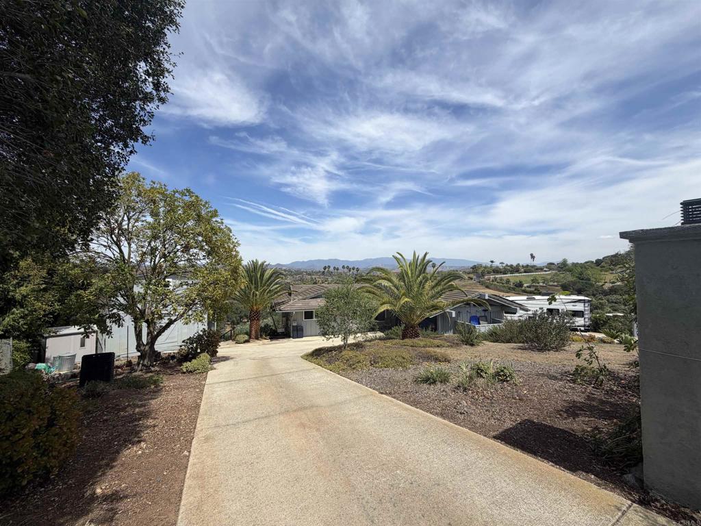 435 Rancho Camino Fallbrook, CA 92028 - Photo 5 of 6 a view of a pathway with a yard