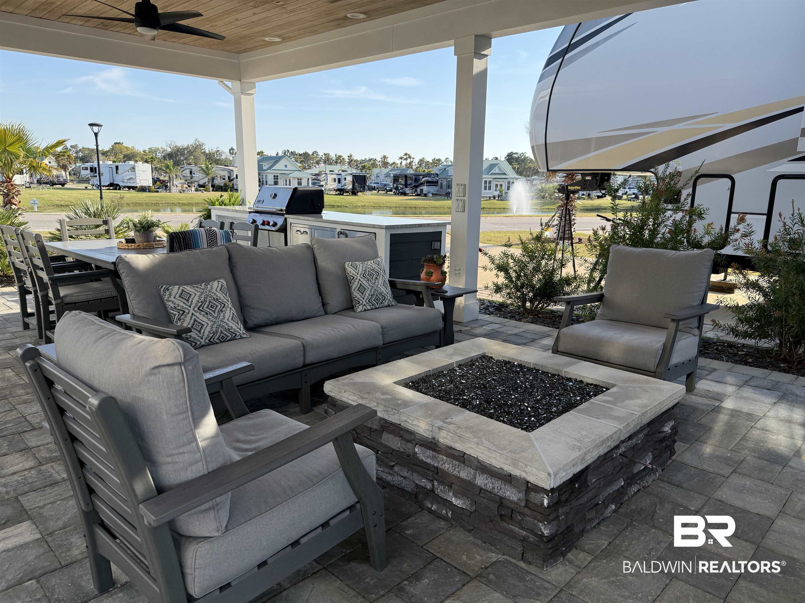 12377 Gateway Drive Elberta, AL 36530 - Photo 15 of 64 View of patio with a residential view, an outdoor living space with a fire pit, a ceiling fan, and a grill