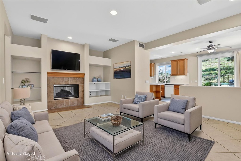 20543 Pesaro Porter Ranch Porter Ranch, CA 91326 - Photo 19 of 67 a living room with furniture flat screen tv and a fireplace