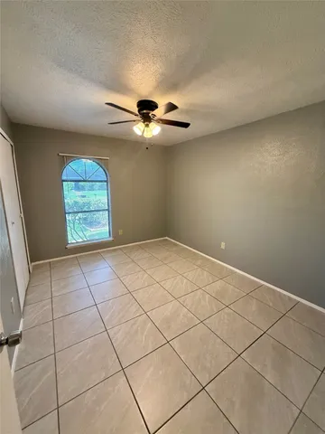 a view of an empty room with windows