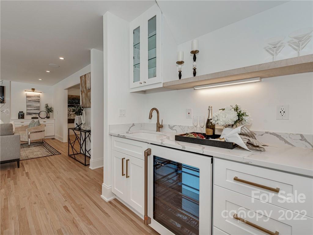 523 Robmont Road Charlotte, NC 28270 - Photo 11 of 26 a kitchen with stainless steel appliances granite countertop a lot of counter space and wooden floor