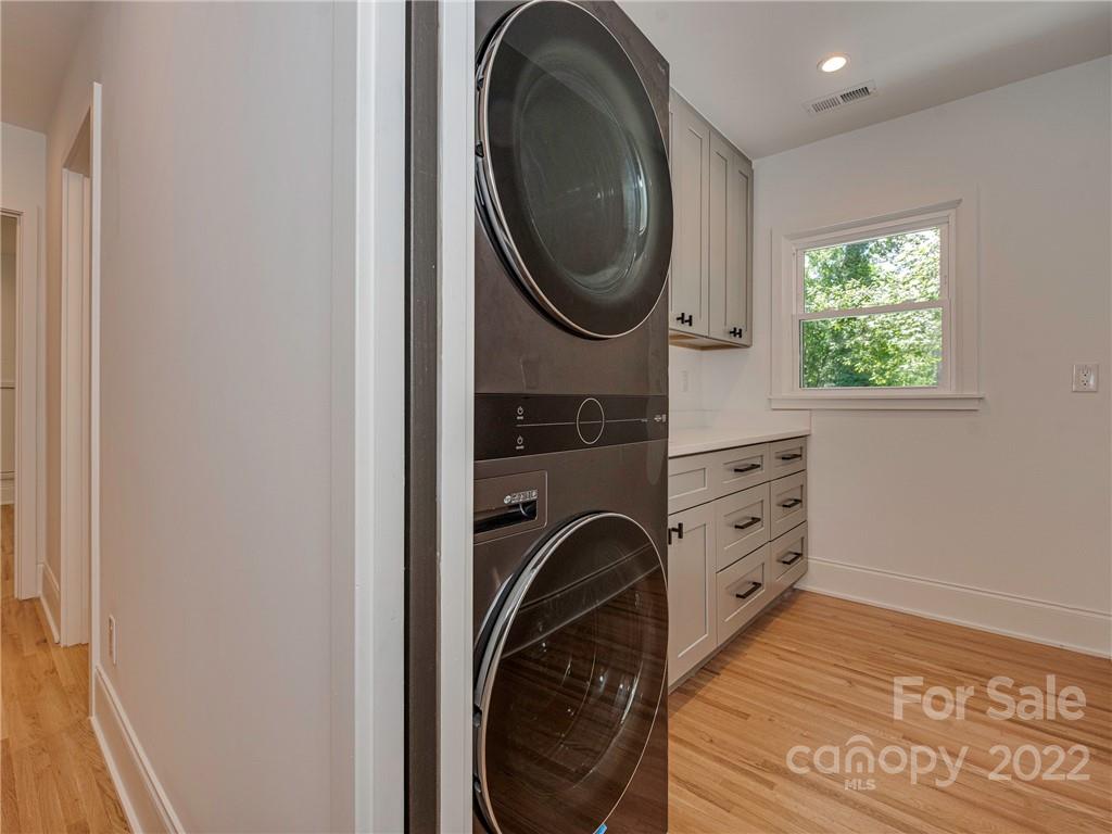 523 Robmont Road Charlotte, NC 28270 - Photo 16 of 26 a view of a hallway with washer and dryer