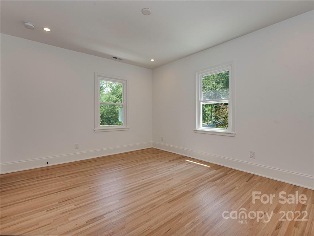 523 Robmont Road Charlotte, NC 28270 - Photo 17 of 26 an empty room with wooden floor and window