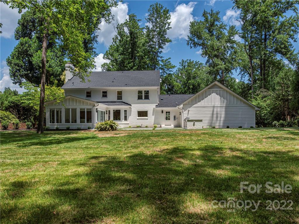 523 Robmont Road Charlotte, NC 28270 - Photo 26 of 26 a front view of a house with a garden