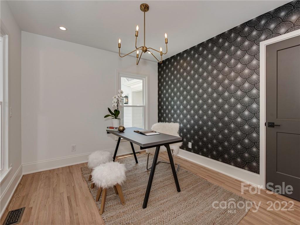 523 Robmont Road Charlotte, NC 28270 - Photo 4 of 26 a workspace with furniture and wooden floor