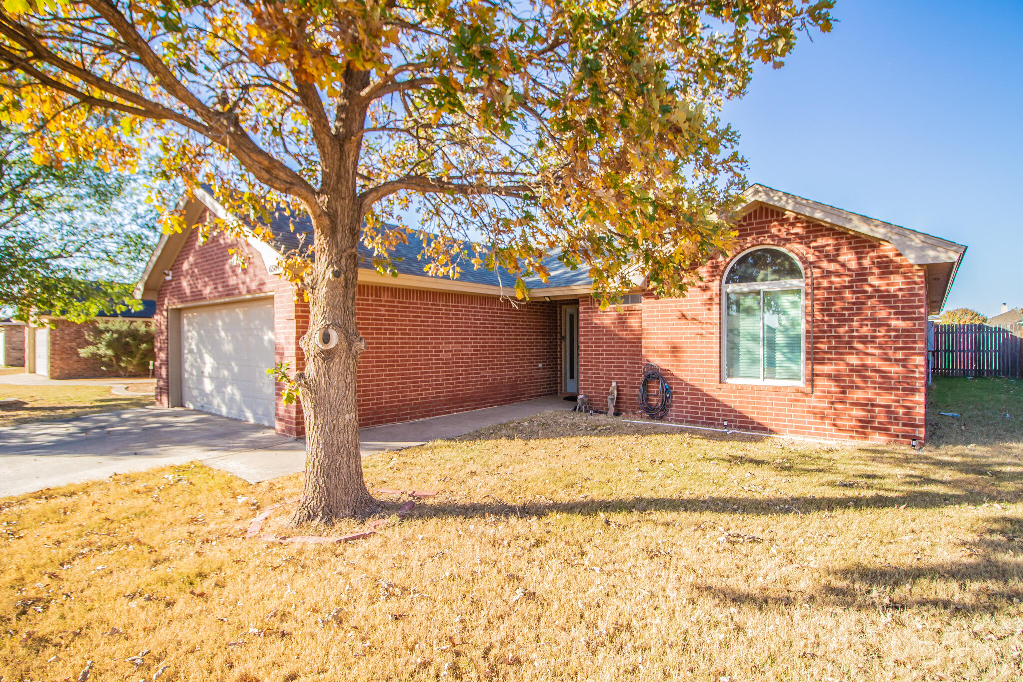 6504 91st Street Lubbock, TX 79424 - Photo 2 of 23 a view of a house with snow on the tree