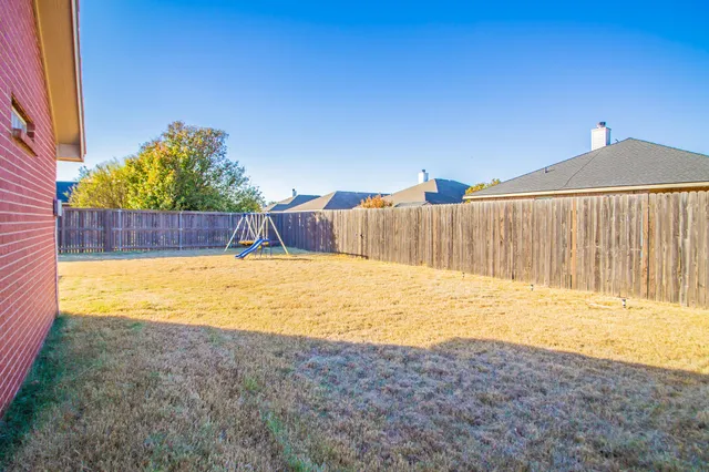 a bathroom with a bathtub and a window
