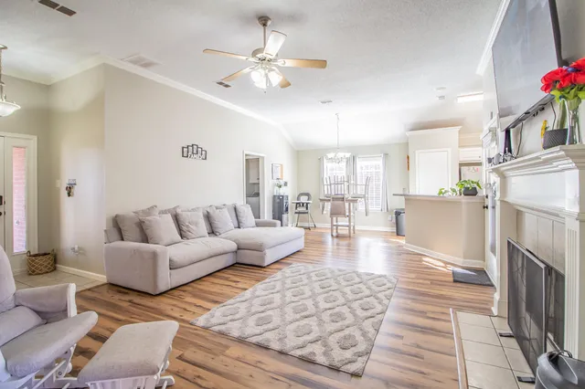 a living room with furniture and a fireplace