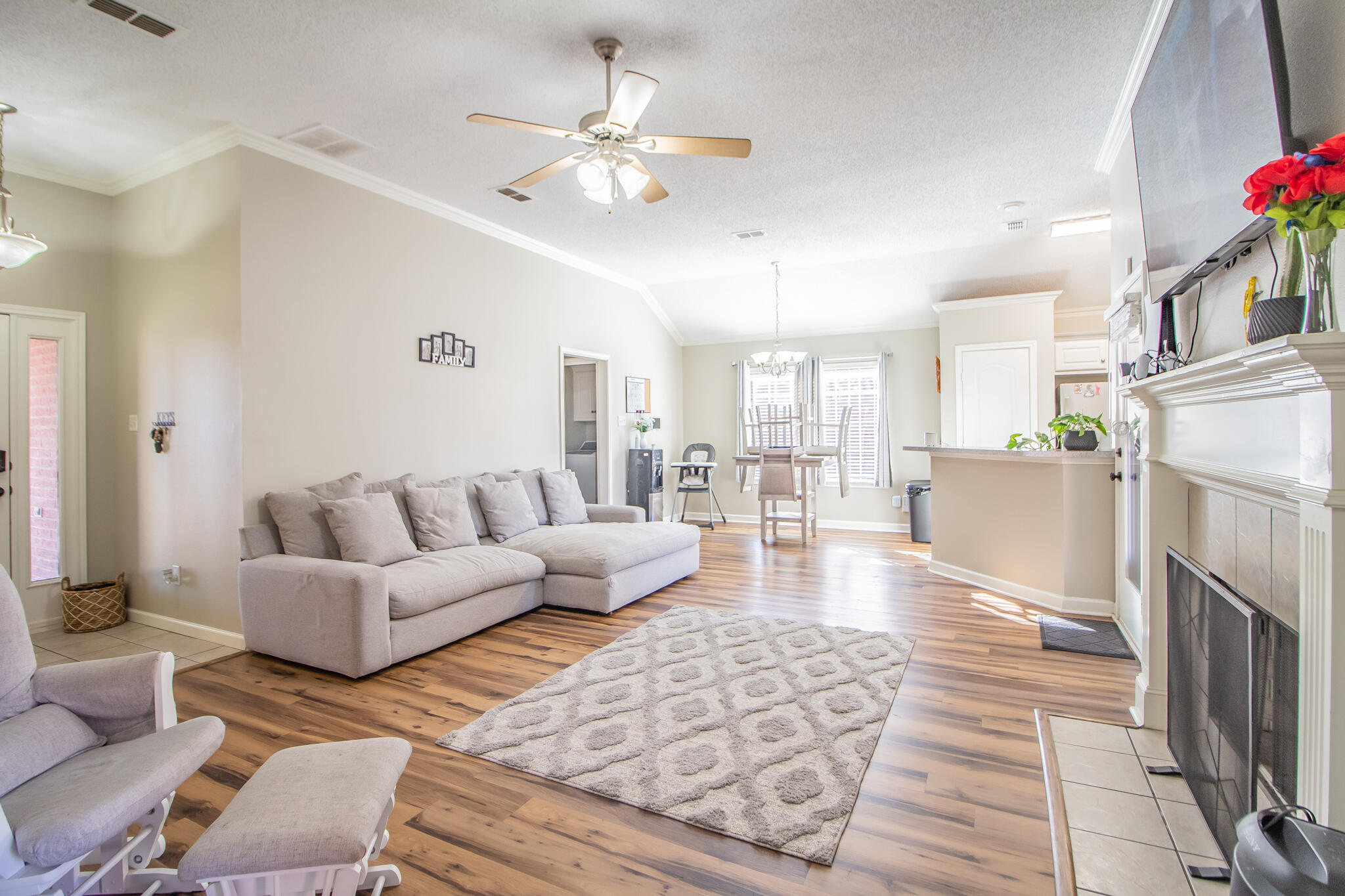 6504 91st Street Lubbock, TX 79424 - Photo 6 of 23 a living room with furniture and a fireplace