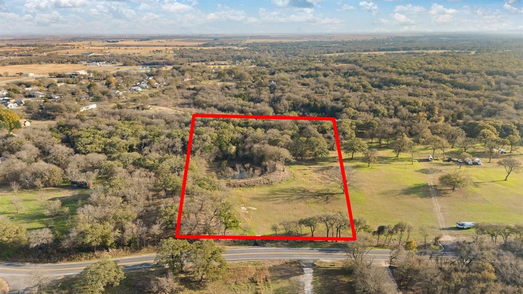 223 West Gaithings Covington, TX 76636 - Photo 2 of 22 Aerial view of property's location with property boundaries highlighted and a forest