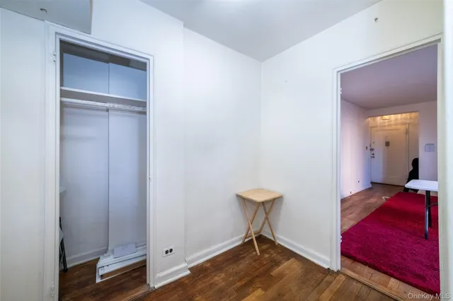 a view of a room with a furniture and wooden floor