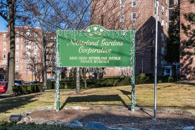 a view of a park with iron fence