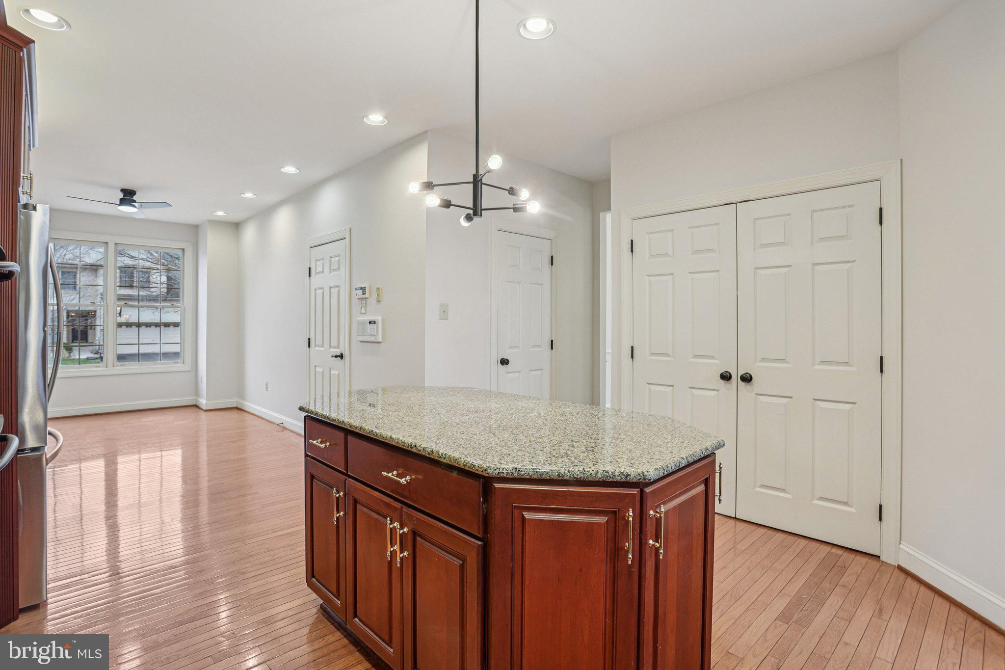 82 Granville Way Exton, PA 19341 - Photo 13 of 51 a kitchen with stainless steel appliances granite countertop hardwood cabinets and wooden floor