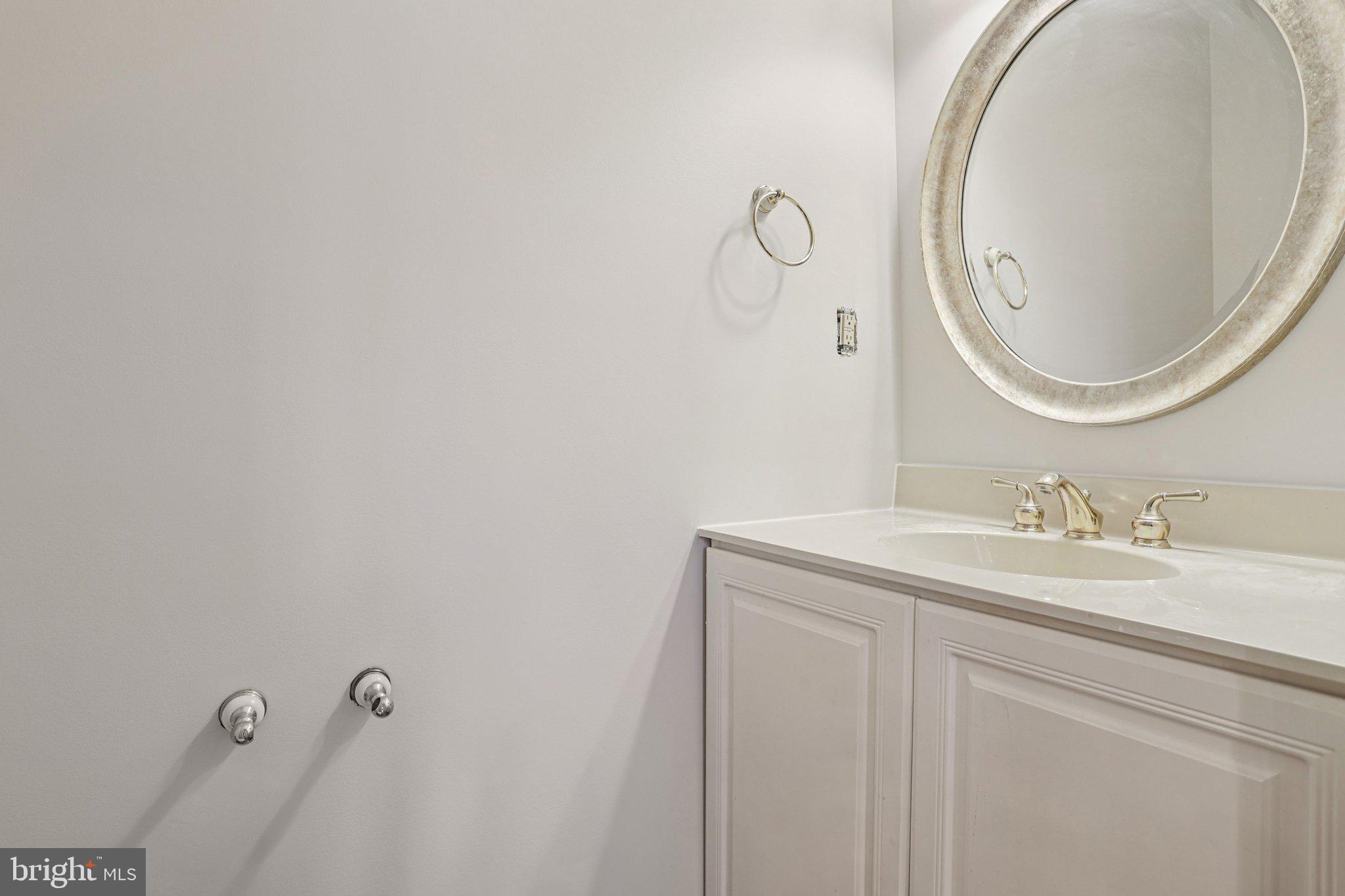 82 Granville Way Exton, PA 19341 - Photo 21 of 51 a bathroom with a granite countertop sink and a mirror