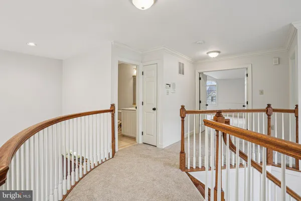 en empty room with windows and fan