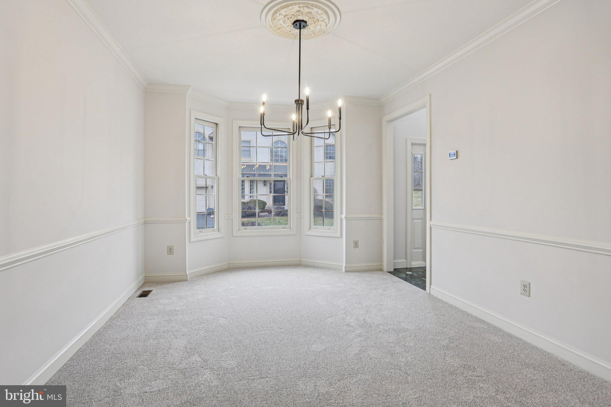 82 Granville Way Exton, PA 19341 - Photo 10 of 51 a view of an empty room with chandelier