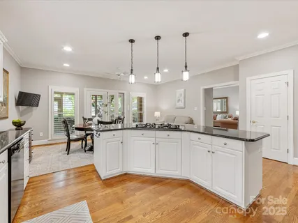 a view of a balcony with chair and wooden floor