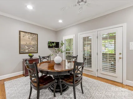 a bedroom with bed and wooden floor