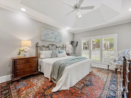 a bathroom with a tub shower and a sink