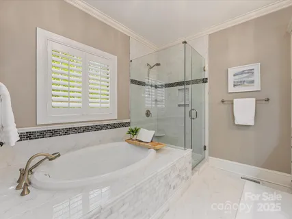 a view of an entryway with wooden floor and windows