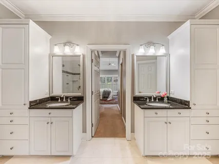 a bedroom with a bed and a lamp