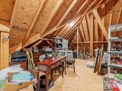 a view of a house with backyard and a tree