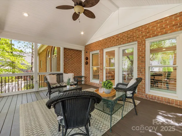 a view of a patio with table and chairs